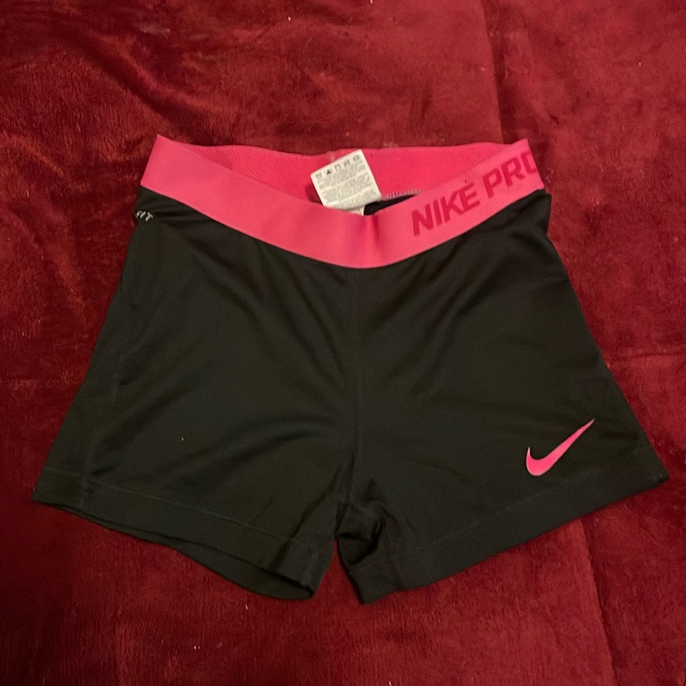 Black Nike pro shorts with pink waistband